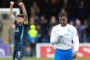 Rangers player Dujon Sterling hangs his head as the full-time whistle blows at the Global Energy Stadium on Sunday as a Ross County player celebrates