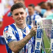 Josh Windass with the trophy