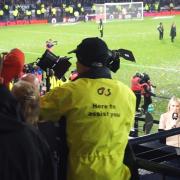 The fan is led away by stewards