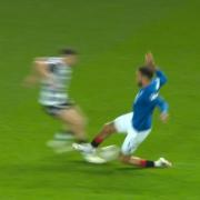 Connor Goldson lunges in on Roy Syla
