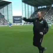 Neil Lennon celebrates on the pitch as his Hibs team secures a 5-5 draw against Rangers on the final day of the 2017/18 season